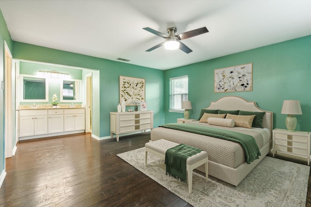 bedroom featuring ceiling fan, dark hardwood / wood-style flooring, and ensuite bathroom