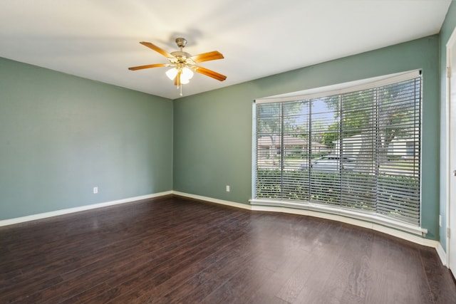 spare room with ceiling fan and hardwood / wood-style flooring