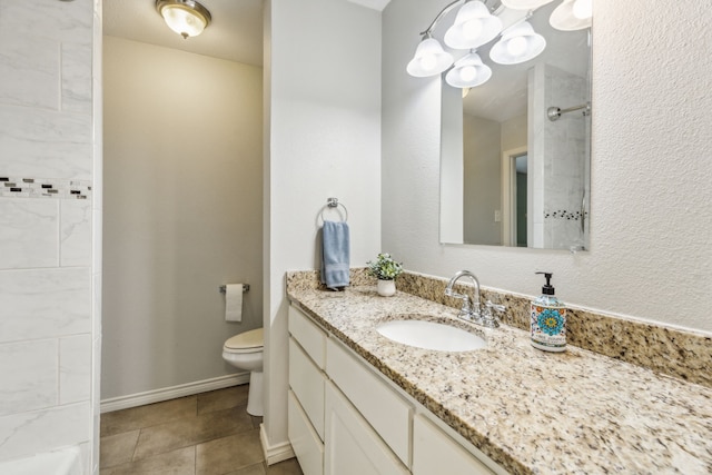 bathroom with toilet, tile patterned floors, and vanity