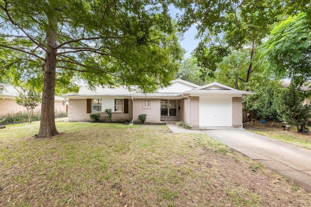 ranch-style house with a front yard and a garage