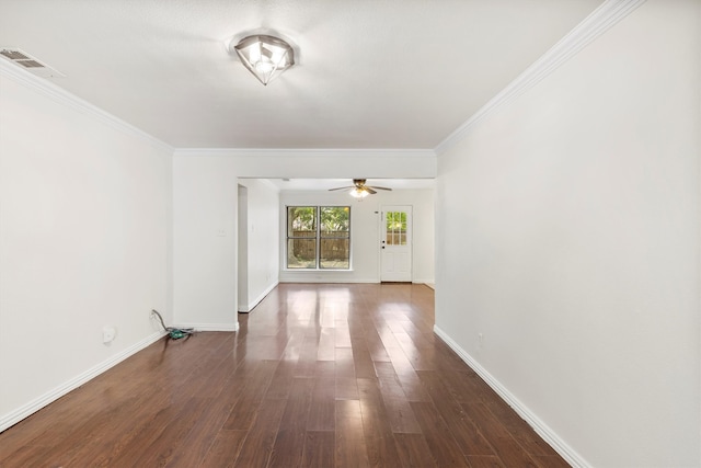 spare room featuring ceiling fan, dark hardwood / wood-style flooring, and crown molding