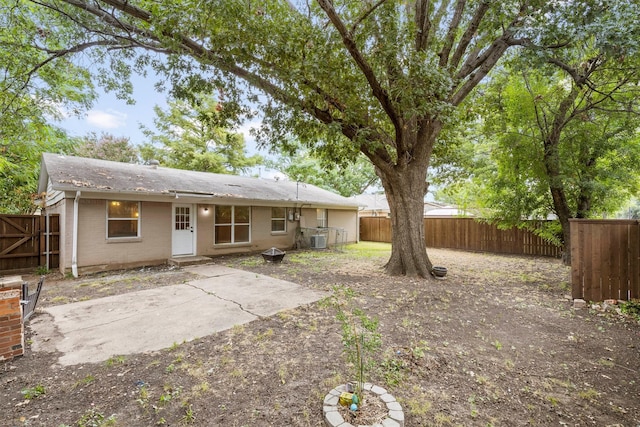 rear view of house with a patio and central air condition unit