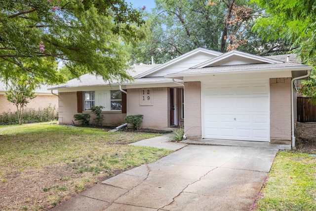 ranch-style house with a garage and a front lawn