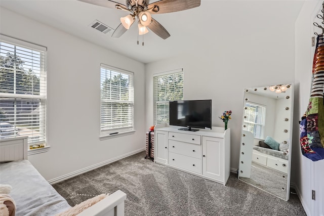 bedroom featuring dark carpet and ceiling fan