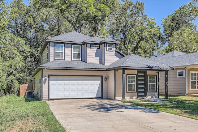 view of front of property featuring a porch, central AC unit, a front yard, and a garage