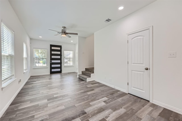 interior space with ceiling fan and light hardwood / wood-style floors