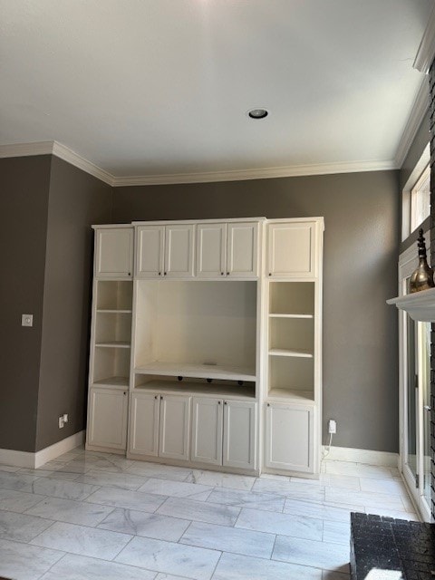 unfurnished living room with ornamental molding