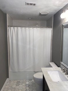 full bathroom with vanity, toilet, and shower / bath combo