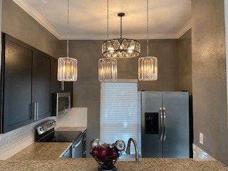 kitchen featuring ornamental molding, light stone countertops, appliances with stainless steel finishes, and an inviting chandelier