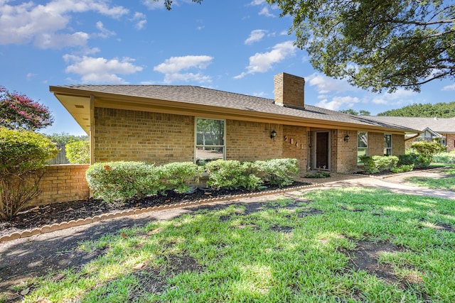 ranch-style home with a front yard