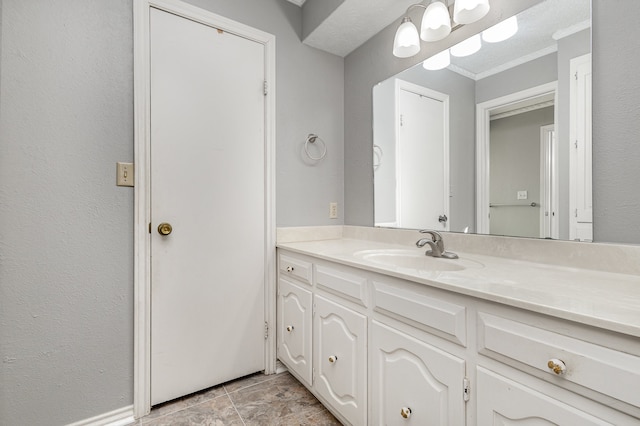 bathroom with vanity and ornamental molding