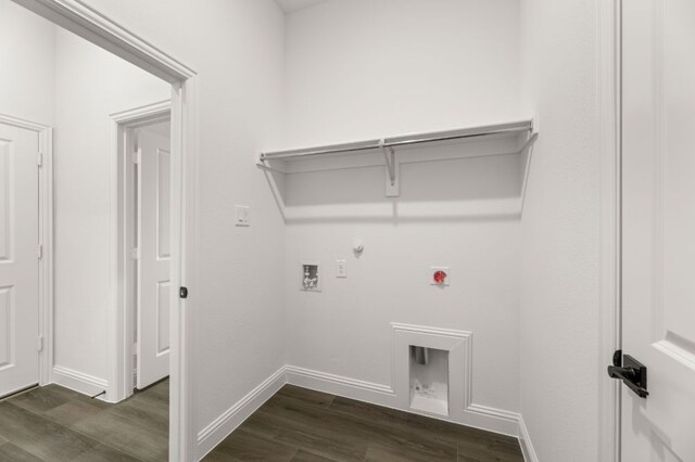 laundry room featuring dark wood-type flooring, hookup for a washing machine, gas dryer hookup, and electric dryer hookup