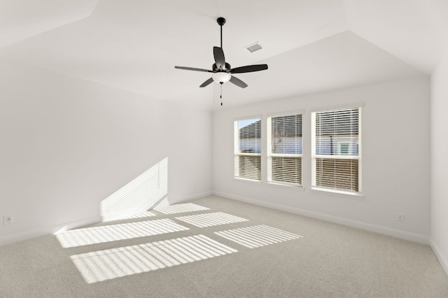 carpeted spare room with ceiling fan and lofted ceiling