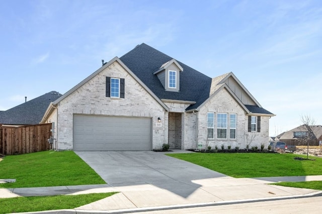 view of front of house featuring a garage and a front lawn