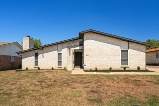 back of house with a yard