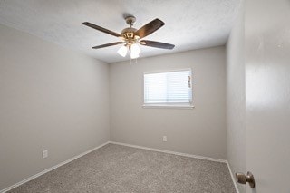 unfurnished room featuring carpet floors and ceiling fan