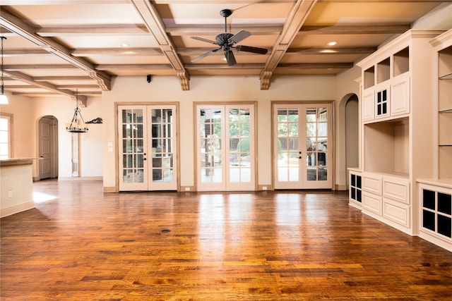 unfurnished living room featuring coffered ceiling, dark hardwood / wood-style floors, ceiling fan, and french doors