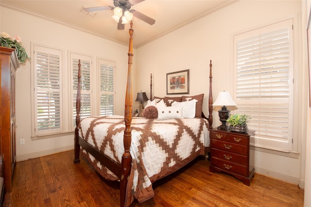 bedroom featuring hardwood / wood-style floors, ceiling fan, and ornamental molding