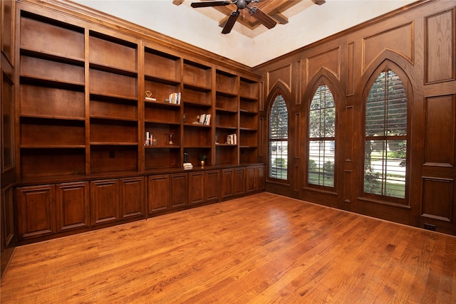 empty room with light hardwood / wood-style floors and ceiling fan