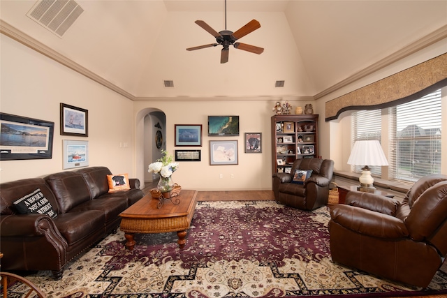 living room with ceiling fan and high vaulted ceiling