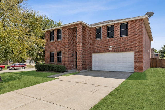 view of front of home featuring a garage and a front yard