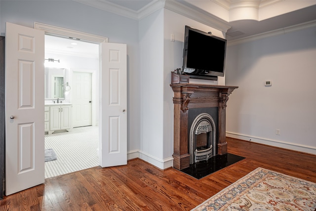 living room with a fireplace, dark hardwood / wood-style flooring, and crown molding