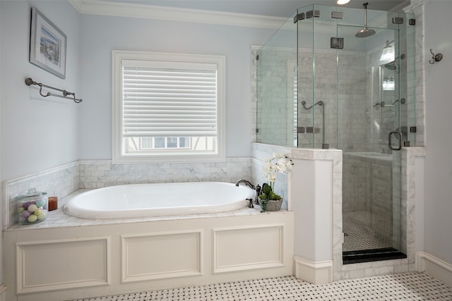 bathroom with ornamental molding and separate shower and tub