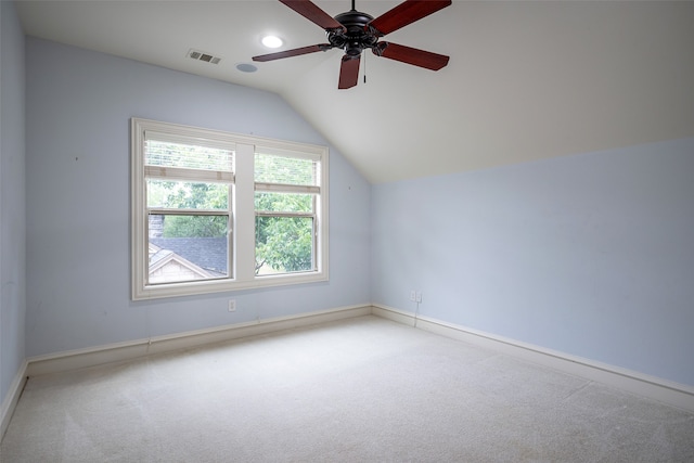 additional living space with light carpet, vaulted ceiling, and ceiling fan