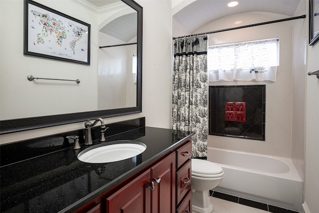 full bathroom with vanity, toilet, shower / bath combo with shower curtain, and tile patterned flooring