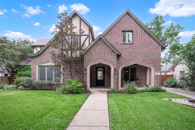 tudor home with a front yard