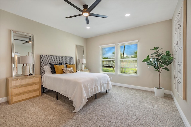 carpeted bedroom featuring ceiling fan, recessed lighting, and baseboards