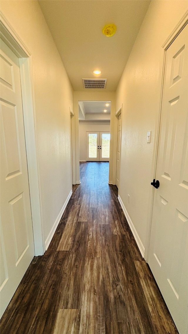 corridor featuring dark hardwood / wood-style floors