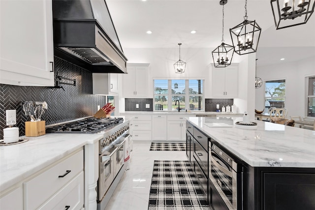 6770 Fm 1372nd Rd, North Zulch, TX 77872 - kitchen with tasteful backsplash, appliances with stainless steel finishes, a sink, a notable chandelier, and premium range hood