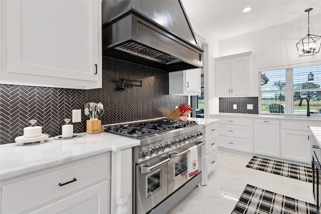 6770 Fm 1372nd Rd, North Zulch, TX 77872 - kitchen featuring range with two ovens, white cabinets, a sink, and premium range hood