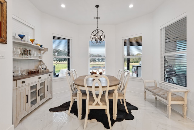 6770 Fm 1372nd Rd, North Zulch, TX 77872 - dining room featuring recessed lighting, marble finish floor, an inviting chandelier, and baseboards