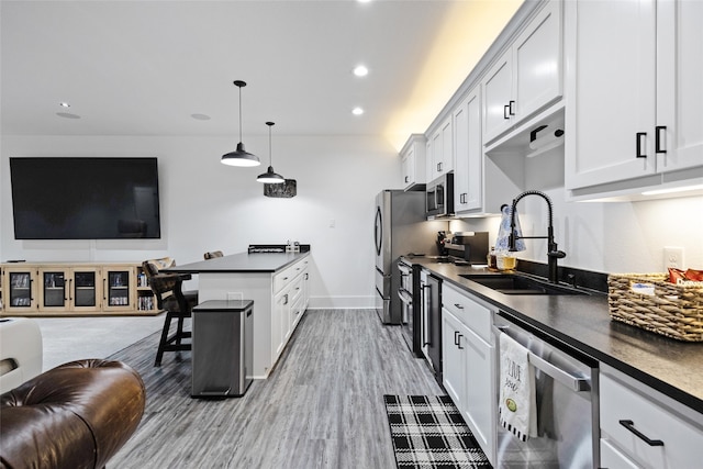 6770 Fm 1372nd Rd, North Zulch, TX 77872 - kitchen featuring open floor plan, dark countertops, stainless steel appliances, and a sink