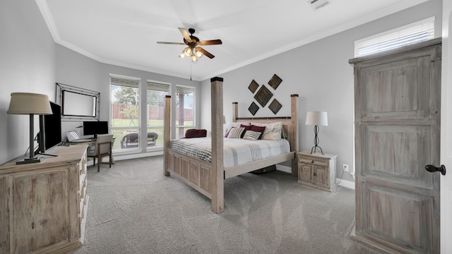 carpeted bedroom featuring ceiling fan and ornamental molding