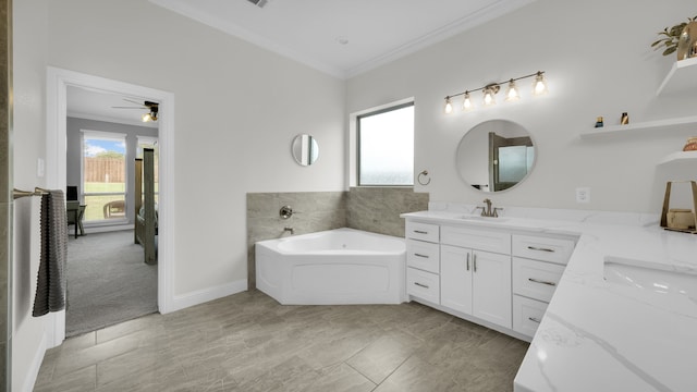 bathroom featuring a tub to relax in, ceiling fan, vanity, and ornamental molding