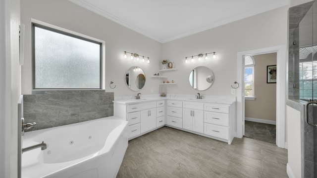 bathroom with vanity, independent shower and bath, and ornamental molding