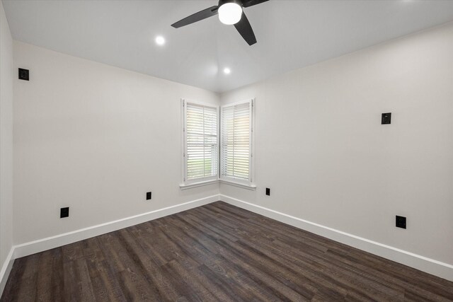 unfurnished room featuring dark wood-type flooring, ceiling fan, and vaulted ceiling