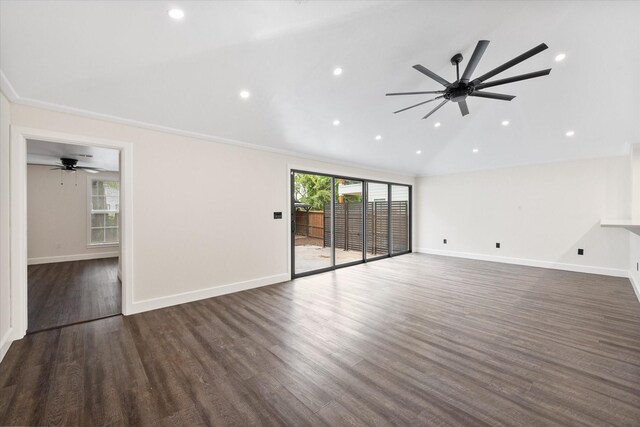 unfurnished living room featuring lofted ceiling, dark wood-type flooring, ceiling fan, and crown molding