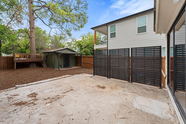 view of patio with a storage shed