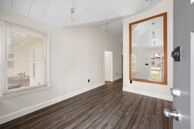 spare room with wood ceiling, vaulted ceiling, and dark hardwood / wood-style floors