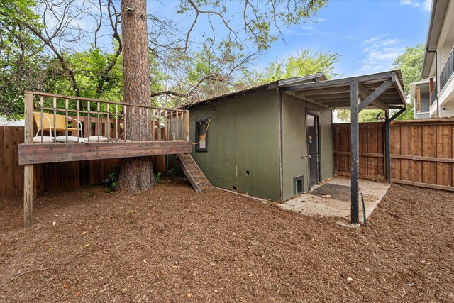 view of yard featuring a wooden deck