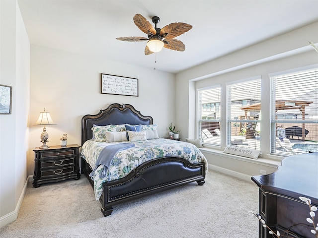 bedroom with ceiling fan and carpet flooring