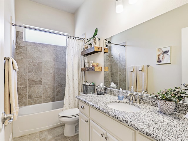 full bathroom featuring shower / bath combo with shower curtain, tile patterned flooring, vanity, and toilet