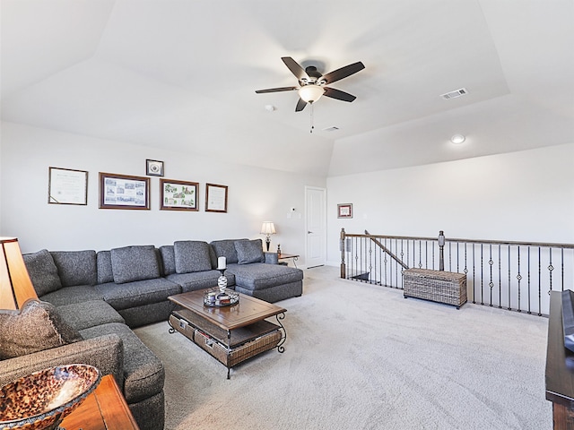 living room with carpet flooring, lofted ceiling, and ceiling fan