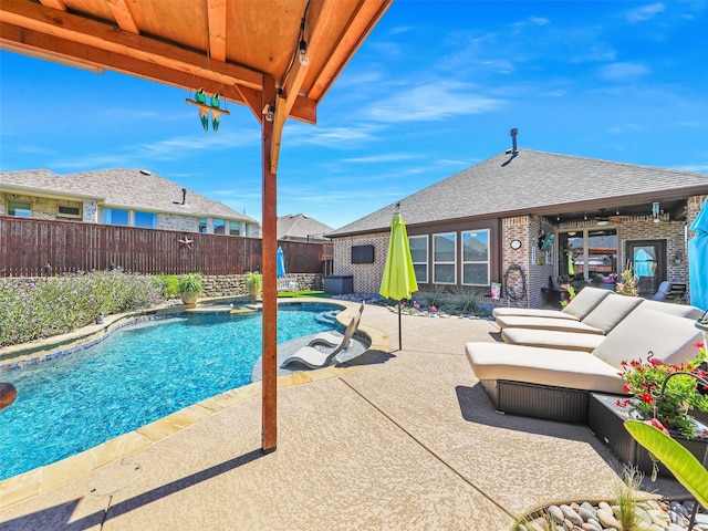 view of swimming pool featuring a patio and ceiling fan