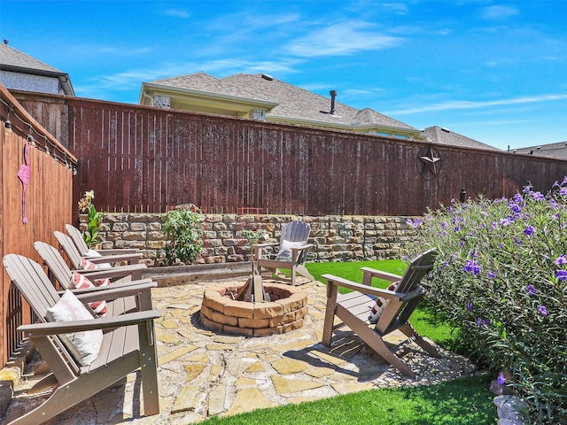 view of patio featuring an outdoor fire pit