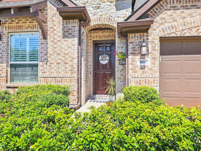 property entrance with a garage